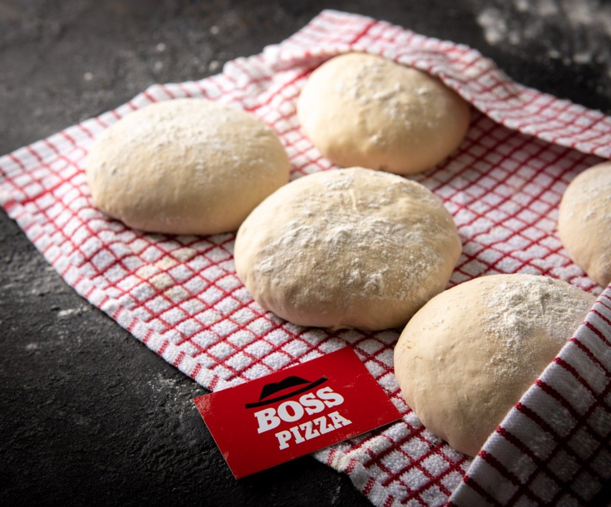 Fresh dough for pizza in a towel